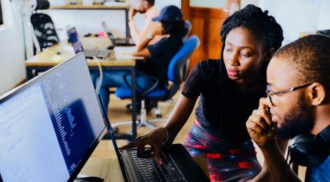 Man and women at a computer